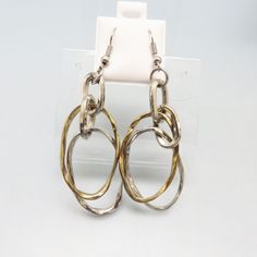 These fun pierced earrings from the 1980 era are just cool. They are made with silvertone and goldtone metal hoops. These are French hook style earrings for pierced ears and measure 2 3/4ths inches high and 3/4 inches wide. They are in very good condition with no maker's markings. These will arrive in a lovely gift box. If you like vintage silver, old jewelry, western bolo ties and more, kindly check out my Etsy store at www.etsy.com/shop/PANDPF Retro Metal Drop Clip-on Earrings, Retro Metal Drop Earrings Jewelry, Retro Metal Drop Earrings, Vintage Nickel-free Metal Hoop Earrings, Retro Gold Metal Hoop Earrings, Retro Dangle Metal Earrings, Retro Metal Dangle Earrings, Retro Round Metal Earrings, Gold Retro Metal Earrings