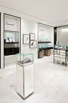 the inside of a jewelry store with glass displays