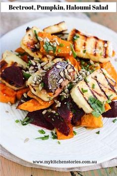 grilled beetroot, pumpkin, and hallowi salad on a white plate