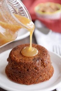 someone is pouring caramel sauce on a dessert