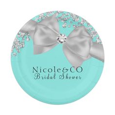 a blue paper plate with silver bows and diamonds on the side that says nicole & co bridal shower