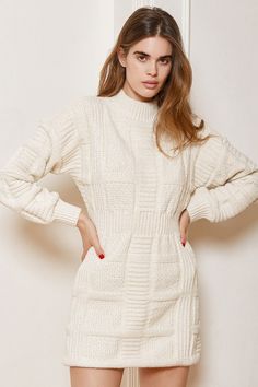 We're loving each and every piece of the Lulus Patchwork It Cream Cable Knit Cutout Sweater Dress! This thick sweater dress has a patchwork-inspired cable knit design that forms a mock neckline, a fitted bodice, and long balloon sleeves with drop shoulders and fitted cuffs. A flirty back cutout tops a bodycon mini skirt. Fit: This garment fits true to size. Length: Mid-thigh. Size medium measures 34" from shoulder to hem. Bust: Great for any cup size. Waist: Fitted - elastic waist allows stretch White Cable Knit Sweater Dress, Cream Sweater Dress, Christmas Outfit Casual, White Knit Dress, Cozy Sweater Dress, Bodycon Mini Skirt, Cutout Sweater, Cable Knit Sweater Dress, Thick Sweater