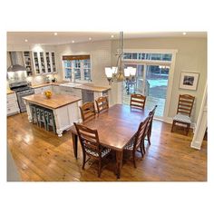 a kitchen and dining room with hardwood floors