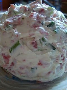 a close up of a bowl of food on a plate with another dish in the background