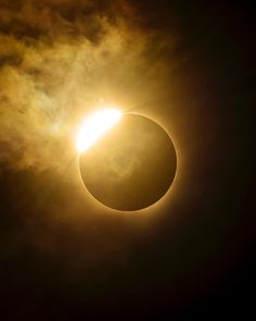 the solar eclipse is seen through clouds in this photo taken on july 22, 2013