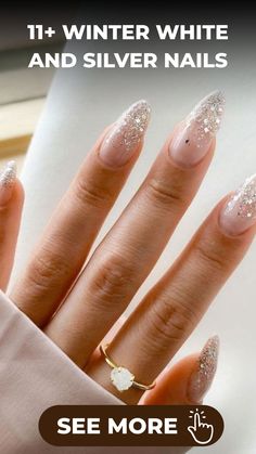 Elevate your style this winter with our stunning collection of white and silver nail designs that are sure to turn heads during the snowy season. Let our skilled nail artists work their magic, crafting intricate details like shimmering snowflake accents and elegant marble effects in shades of white and silver. Embrace the frosty glam trend effortlessly by booking your appointment now. It's time to make a statement with your manicure - get ready to shine all season long! White Holiday Nails Winter, Cream And Silver Nails, Sparkly Silver Nails Acrylic, Christmas Nails Simple Snow Flake, Festive White Nails, White Glitter Oval Nails, Ivory Sparkle Nails, Wedding Nails Christmas, Silver Floral Nails