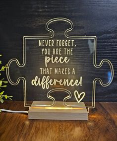 a light up puzzle piece that says never forget, you are the piece that makes a difference