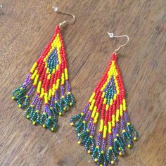 Gorgeous Beaded Fringe/Tassel Statement Earrings! Brand New Boutique Item In Original Packaging. Colorful Yellow And Red Beads With Iridescent Purple And Green Accents. So Beautiful And Fun! Hook Earrings. Hardware Is Bronze Toned. Approximate Measurements Length From Center Of Hook 4” Width At Widest 1.5” Tags Anthropologie Urban Outfitters Free People Zara Lucky Brand Madewell J. Crew Boho Tribal Festival Fringe Colorful Gypsy Tapestry Yellow Beaded Fringe Earrings For Festival, Multicolor Fringe Beaded Earrings With Round Beads, Traditional Multicolor Beaded Fringe Tassel Earrings, Traditional Yellow Beaded Earrings With Dangling Beads, Traditional Multicolor Beaded Earrings With Tassels, Traditional Multicolor Beaded Tassel Earrings, Traditional Multicolor Fringe Earrings, Yellow Beaded Fringe Earrings With Round Beads, Yellow Fringe Beaded Earrings With Round Beads