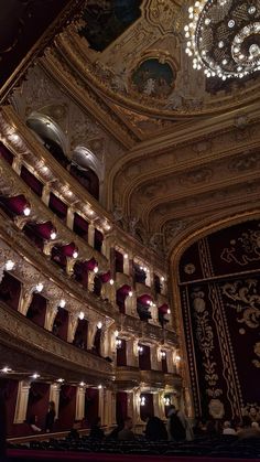 an ornately decorated auditorium with chandeliers