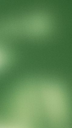 a blurry green background with small white dots