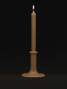 a candle is lit on a black background