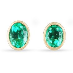 Displayed are vivacious, bezel set, natural Colombian emeralds yellow gold bezel studs in 18K. Make a stylish statement with these beauties, fashioned after Angelina Jolie and Kendall Jenner. These 18K gold stud earrings are handmade by our expert jeweler and sparkle with an approx total weight of 3.90 carats of natural Colombian emeralds. The gemstones have a beautiful rare green color with very good eye clarity, minor imperfections are absolutely normal in genuine gemstones. The earrings are a Oval Gemstone Earrings In 14k Gold, 14k Gold Oval Gemstone Earrings, Oval Fine Jewelry Earrings With Bezel Setting, Formal Oval Earrings With Bezel Setting, Formal Oval Bezel Set Earrings, Fine Jewelry Oval Cabochon Earrings, Oval Cabochon 14k Gold Earrings, 14k Gold Oval Cabochon Earrings, Oval Cabochon Earrings For Anniversary