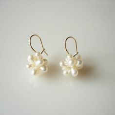 These flower shape earrings are made from freshwater pearls and 9ct gold or sterling silver safety ear hook. The pearl flowers drop delicately just under earlobe. Earring size approx. 21mm length from top of the hook, pearl flower size approx. 13mm x 13mm. The earrings are available in either 9ct yellow gold or sterling silver ear hook. Please choose your ear wire when you check out. Handmade Flower Pearl Earrings, Handmade Flower-shaped Pearl Earrings, White Flower-shaped Earrings With Pearl Charm, Elegant Floral Earrings With French Hook, Elegant Flower Shaped Earrings With French Hook, Pearl Flower Earrings With Flower Charm, Delicate Pearl Earrings With Ear Wire, Pearl White Drop Earrings With Pearl Drop, Pearl White Flower Drop Earrings