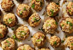 an overhead view of meatballs with parmesan cheese and chives on top