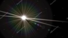 the sun shines brightly on a black background with lens flares in the center