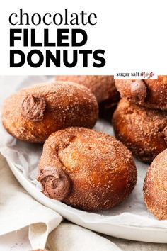 chocolate filled donuts on a white plate with the title above it in black and white