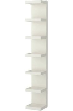 a white book shelf with five shelves on each side