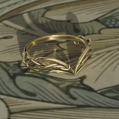 To see our entire Elven collection, click here: https://www.etsy.com/shop/MetalWendler?ref=seller-platform-mcnav&search_query=elvish This Woodlands Vine Fantasy themed engagement ring is made from recycled gold and is handmade with a comfort fit to your size. Perfect for the nature lover.  Ring Specs: ● Band is 6.8mm at widest point, then tapers thinner towards the bottom for an elegant curve.  ● Metals: 10-18k gold. This ring is available with different metals, message me about your idea.   I o Fantasy Wedding Bands, Sinple Rings, Elven Jewelry Rings, Elven Ring Men, Fantasy Inspired Rings, Fantasy Wedding Band, Curved Ring Band, Fantasy Wedding Ring Set, Sapphic Wedding Rings