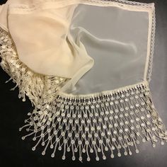 Cream chiffon fabric shawl with 6 1/2 inches long fringe.  Measurements. So elegant for Wedding  Mother of bride or mother of groom.  Triangle shape Shawl with trim measures See picture of measurement.  56 inches long on long side.   29 inches long on center  6.5 inches long fringe https://www.etsy.com/shop/BlingScarves/search?search_query=earrings&order=date_desc&view_type=gallery&ref=shop_search #shawl #bride #wedding #handmade #fringeshawl #scarf Wedding Scarf, Queen Nefertiti, Fringe Shawl, Long Fringes, Wedding Shawl, Lace Scarf, Triangle Shape, Mother Of The Groom, Chiffon Fabric