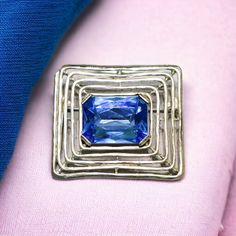 Large Silver and Blue Glass Brooch | Vintage Modernist Rhinestone Pin; silver tone metal brooch with foil back, sapphire blue glass stone no maker's marks 2 x 1 3/4 inches excellent, ready to wear condition **Save 30% if you purchase 3 or more listings. Just enter coupon code 30OFF at checkout.** Formal Blue Gemstone Brooch, Formal Blue Gemstone Brooches, Blue Gemstone Brooch For Anniversary, Blue Gemstone Brooches For Anniversary, Blue Art Deco Formal Brooch, Blue Gemstone Brooch For Gift, Art Deco Blue Brooches As Gifts, Art Deco Blue Brooches For Gifts, Vintage Sapphire Brooches For Gifts