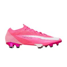 a soccer shoe with pink and white accents