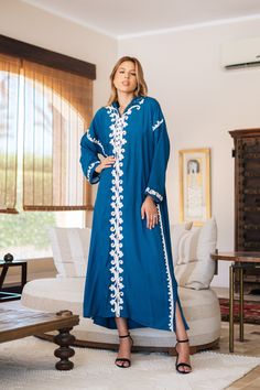 *Note : The kaftan in the video is a different color and is only displayed to show the fit, flow, and cut of the Kaftan. You will receive the one in the pictures.* Feel like a Royalty! This Kaftan maxi dress is ideal to wear for any casual occasion. Whether a wedding, gathering, taking a trip down the shopping lane, or home-based kitty parties, or about anything else, wearing this dress will make you feel classy and comfortable.  The perfect house dress for lounging or having a coffee in your ba Tunic Abaya For Eid Vacation, Eid Vacation Tunic Abaya, Eid Tunic Abaya For Vacation, Blue Kaftan With Chikankari Embroidery For Eid, Eid Beach Kimono, Long Abaya For Eid Vacation, Blue Chikankari Embroidery Kaftan For Eid, Blue Maxi Kaftan With Dabka Detail, Blue Maxi Length Kaftan With Dabka