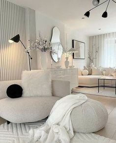 a living room filled with furniture and mirrors