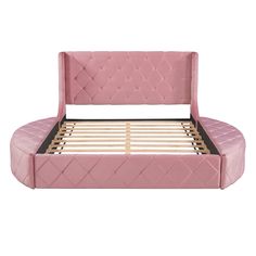 the pink bed frame is made up and ready to be used as a headboard