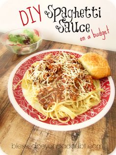 spaghetti sauce on a red and white plate with bread