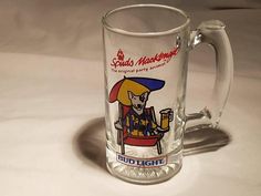 a glass mug with a cartoon character on it