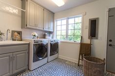 a washer and dryer in a small room