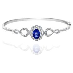 A unique and fashionable Sapphire bangle showcasing an openwork design set with 1.71 carat of Sapphire and 124 brilliant diamonds weighing 1.39 carat in total. Made in 18k white gold. Style available in different price ranges. Prices are based on your selection. Please contact us for more information. American Diamond Ring, Sapphire Bangle, Blue Sapphire Bracelet, Diamond Bangle Bracelet, Diamond Bangles Bracelet, Stone Bangle, White Gold Bracelet, Sapphire Bracelet, Diamond Bangle