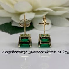 "These earrings are radiant cut lab created green emerald studs, 14k yellow gold #6228 -Approximate total carat weight: 3.50ctw diamond equivalent -Stone Size: approx. 1.75ct each diamond equivalent -Gem Type: emerald -Stone Shape: radiant cut 7x7mm each -Stone Clarity: VS2 -Stone Color: green -Moh's Scale: 8.5 Hardness -Metal Type and Purity: 14k yellow gold -Setting: 4 prong basketsetting -Backing: screw back (earring backs are subject to change due to availability) -Country of Manufacturing: Green Baguette Cut Earrings For Gifts, Green Baguette Cut Earrings For Formal Occasions, Green Earrings For Anniversary, Emerald Cut Green Earrings, Green Emerald Earrings With Prong Setting, Emerald Studs, Emerald Stud Earrings, Earrings Square, Unisex Earrings