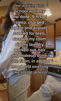 a woman standing in front of a kitchen counter