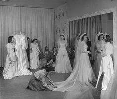 an old black and white photo of women in wedding dresses