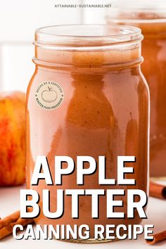 an apple butter canning recipe in a glass jar with cinnamon sticks and apples behind it