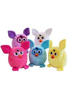 three small stuffed animals are in the shape of an owl and two smaller ones with big eyes