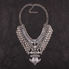 Our Jordan Maxi Statement Necklace is a big, rock star/ bohemian style necklace in vintage silver. This necklace features intricately etched dangling charms that adds an ethnic flair. Watch your outfit transform with an antique, gypsy vibe. Material: Environmental Zinc Alloy This is a special occasion item, and it is FINAL SALE. Big Rock, Dangle Charms, Style Necklace, Vintage Silver, Bohemian Style, Antique Jewelry, Zinc Alloy, Antique Silver, Final Sale