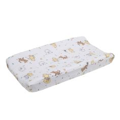 a baby crib mattress with animals on it's cover and the bottom half is white