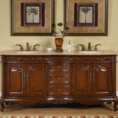 a bathroom vanity with two mirrors above it