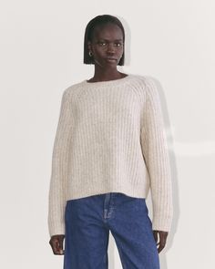 About This Style. This piece features a crew neck, relaxed fit, raglan sleeves, and a gently cropped length that hits higher at the hips, in a ribbed chunky yet plush Cloud yarn—an alpaca, merino, and cotton blend. Cozy Ribbed Cropped Sweater In Relaxed Fit, Raglan Sleeve, Alpaca, Sweaters & Cardigans, Winter Outfits, Sweaters For Women, Cotton Blend, Relaxed Fit, Yarn