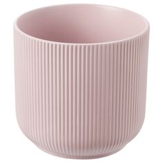 a large pink vase sitting on top of a white table