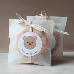 there is a bag of donuts in the shape of a bear with a tag on it