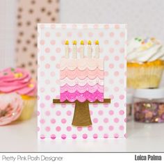 a birthday card with cupcakes in the background and a pink cake on top