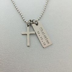 Personalised Boy Baptism Necklace, Men First Communion Necklace, Baby Boy Cross Necklace, Christening Gift, Little Boy Name Necklace ♥Please be sure to drop a name ( max. 9 letters ) and date in the note box at checkout.♥ This listing includes:. 9 x 25mm stainless steel bar tag. 12 x 20mm stainless steel cross charm. High quality stainless steel chain with lobster clasp. Comes in our signature cotton pouch♥ Please review our shop policies before orderinghttps://www.etsy.com/au/shop/AnesandEve?re Personalized Cross Pendant Necklace For Baptism, Personalized Cross Necklaces For Baptism, Personalized Wedding Cross Pendant Necklace, Personalized Cross Jewelry For Baptism, Customizable Cross Jewelry For Baptism, Engraved Cross Pendant Necklace For Baptism, Engraved Cross Necklace For Baptism, Personalized Cross Necklaces For Wedding, Personalized Spiritual Necklace For Baptism