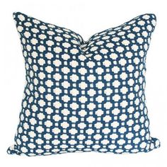 a blue and white pillow on a white background