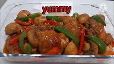 chicken and peppers in a glass dish with the words yummy above it on top