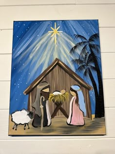 a nativity scene with three wise men and a baby jesus in the manger