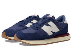 New Balance Classics 237v1 - Men's Shoes : Nb Navy/Vintage Indigo : Add a vintage runner design to your wardrobe with the iconic silhouette of the New Balance Classics 237v1 sneakers. Casual fashion shoe in a sporty silhouette. Textile and synthetic upper with lace-up closure. Foam-padded collar and tongue. Breathable textile lining with removable insole. Synthetic rubber outsole for added traction. Imported. Measurements: Weight: 12 oz Product measurements were taken using size 9, width D - Med Low-top Running Shoes With Contrast Sole, Retro Sneakers With Laces For Sports, Retro Lace-up Sneakers For Sports, Casual Nylon Running Shoes With Contrast Sole, Athleisure Textile Sneakers With Rubber Waffle Outsoles, Mid-top Running Sneakers With Rubber Waffle Outsoles, White Sole Low-top Nylon Running Shoes, Retro Running Shoes With Rubber Sole For Sports, Nylon Running Shoes With Contrast Sole For Sports