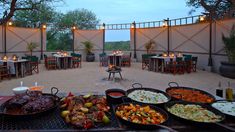 an outdoor dining area with many different types of food